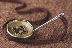 Comment coudre un bouton pour porter chance